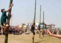 Nagaland Tribal Game | Participants at a greased pole climbing event