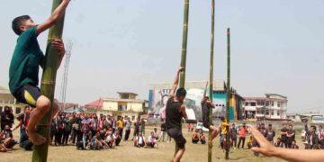 Nagaland Tribal Game | Participants at a greased pole climbing event