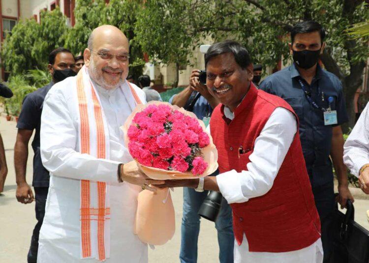 Union Tribal Affairs Minister Arjun Munda welcoming Union Home Minister Amit Shah at the inauguration of NTRI