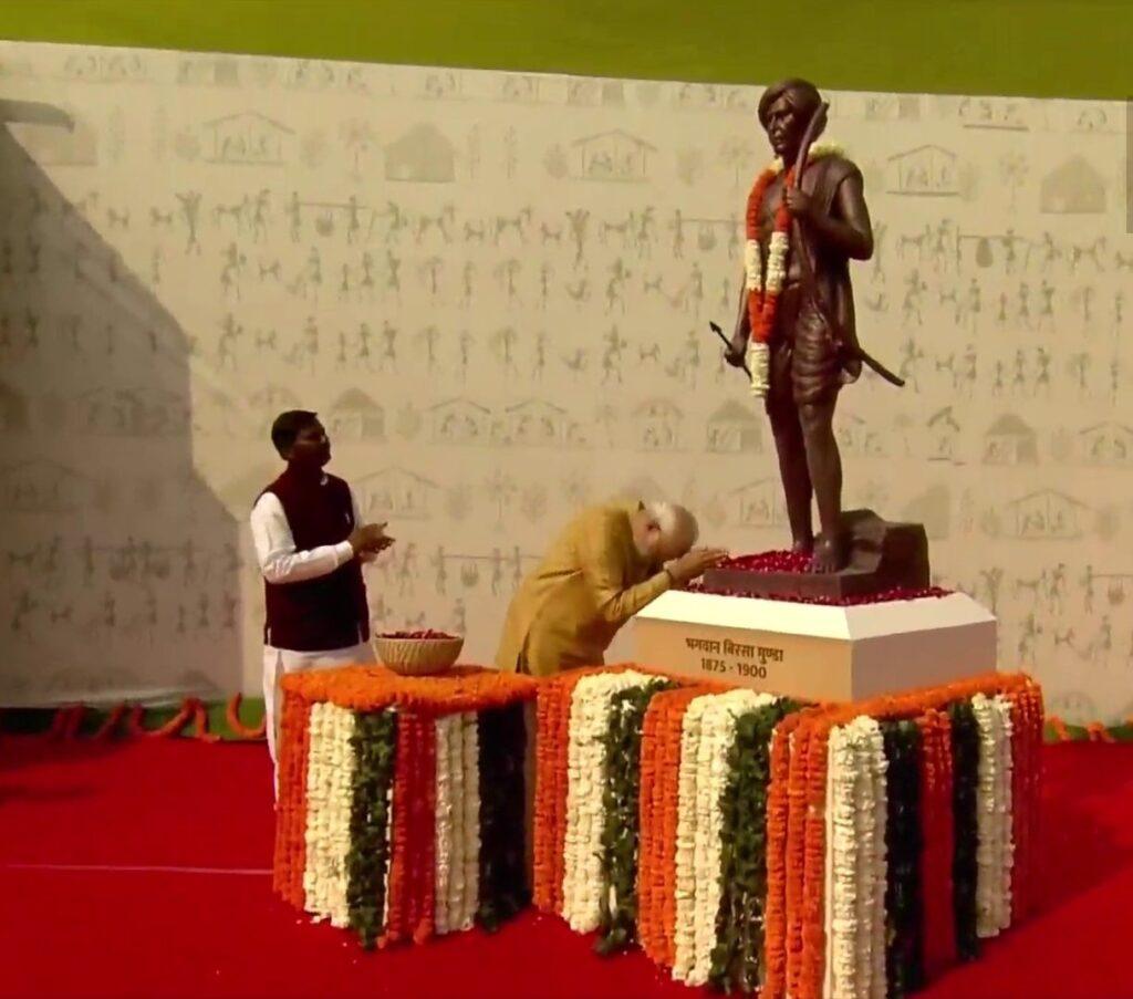Aadi Mahotsav - Prime Minister Narendra Modi Paying His Tribute To Tribal Icon Birsa Munda. Tribal Affairs Minister Arjun Munda Accompanied Him