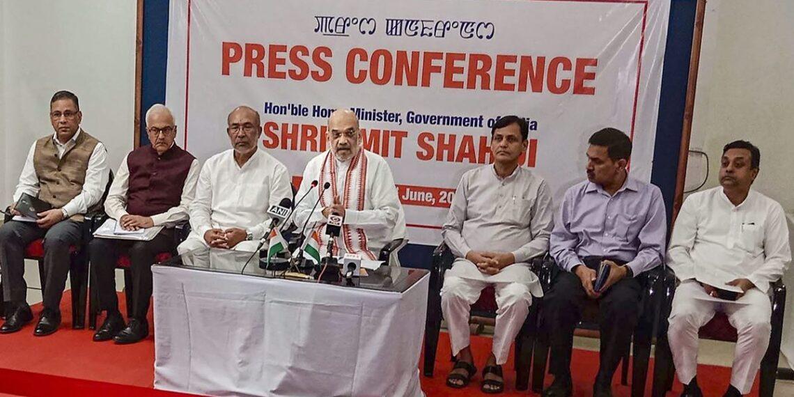 Union Home Minister Amit Shah with Manipur Chief Minister N. Biren and others addresses a press conference, in Imphal, Manipur, Thursday, June 1, 2023