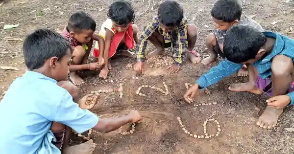 The Indian Tribal | Children learning counting through stones 