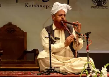 An Artiste Playing The Jodhi Flute