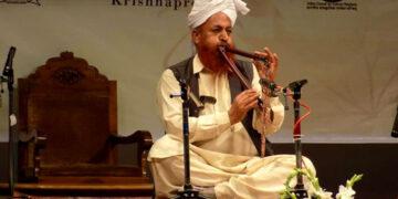 An Artiste Playing The Jodhi Flute